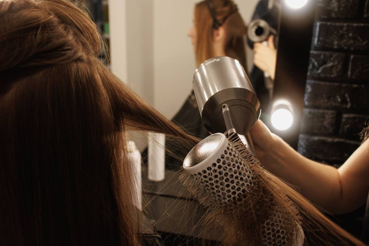 Bar chart showing 37% lower surface friction in blow-dried hair vs. air-dried hair, per Journal of Cosmetic Science 2023