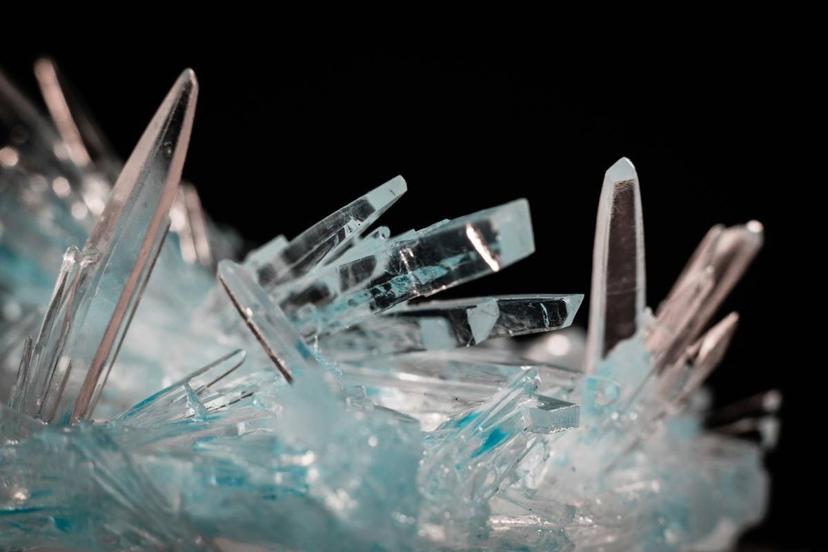 Side-by-side comparison of lead-free crystal vs. plastic rhinestone hair pins under light, showing superior sparkle and clarity of genuine crystal