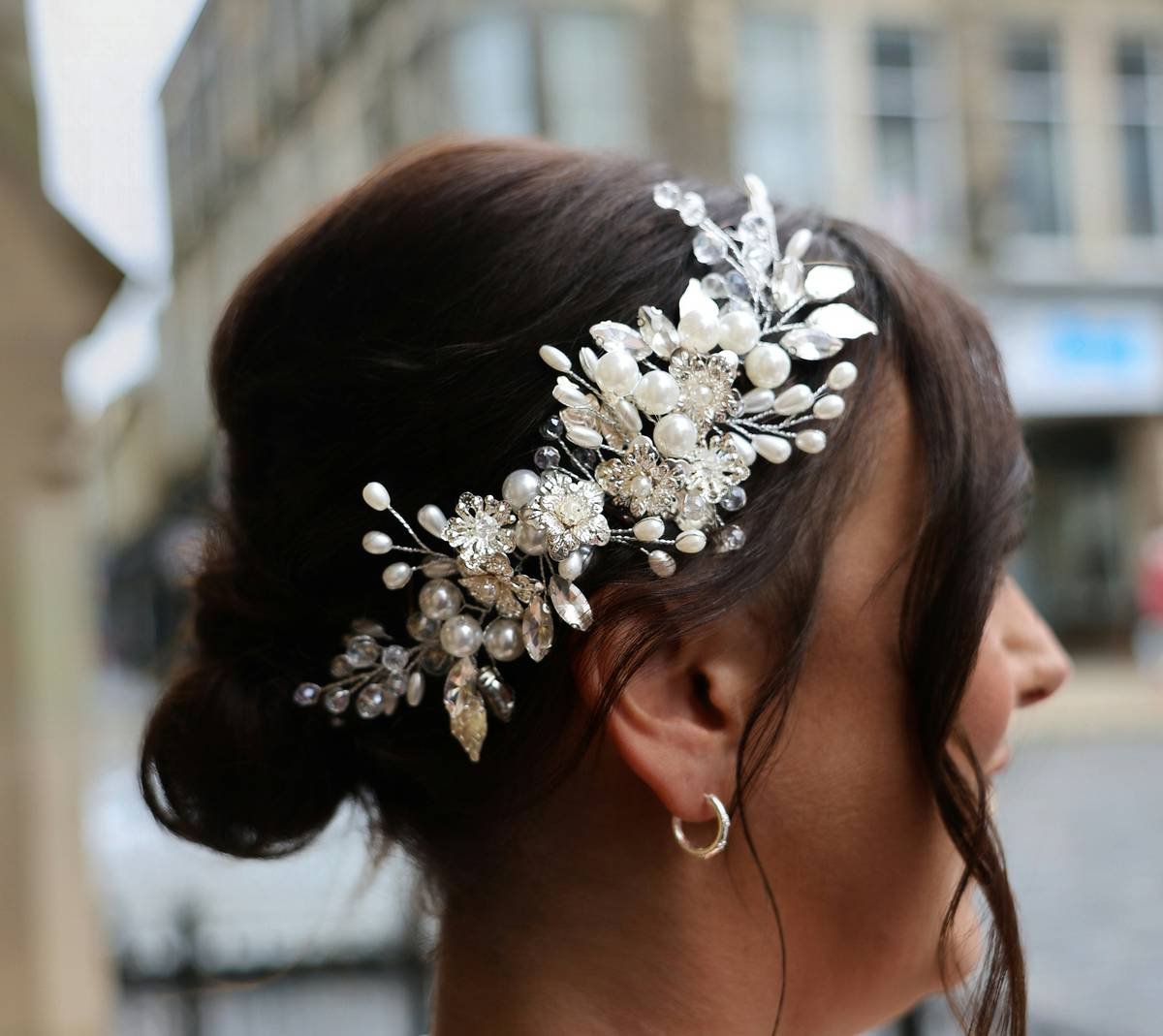 Assorted metallic hair pins in mixed finishes and lengths arranged on velvet